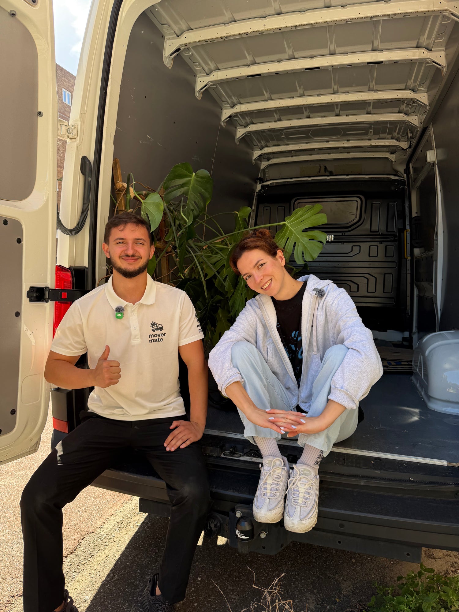 MoverMate driver loading boxes into a white van in Amsterdam